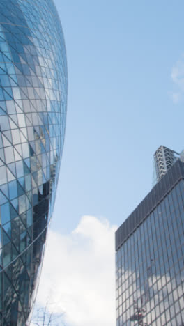 Vertical-Video-Showing-Exterior-Of-The-Cheesegrater-And-The-Gherkin-Modern-Office-Buildings-In-City-Of-London-UK